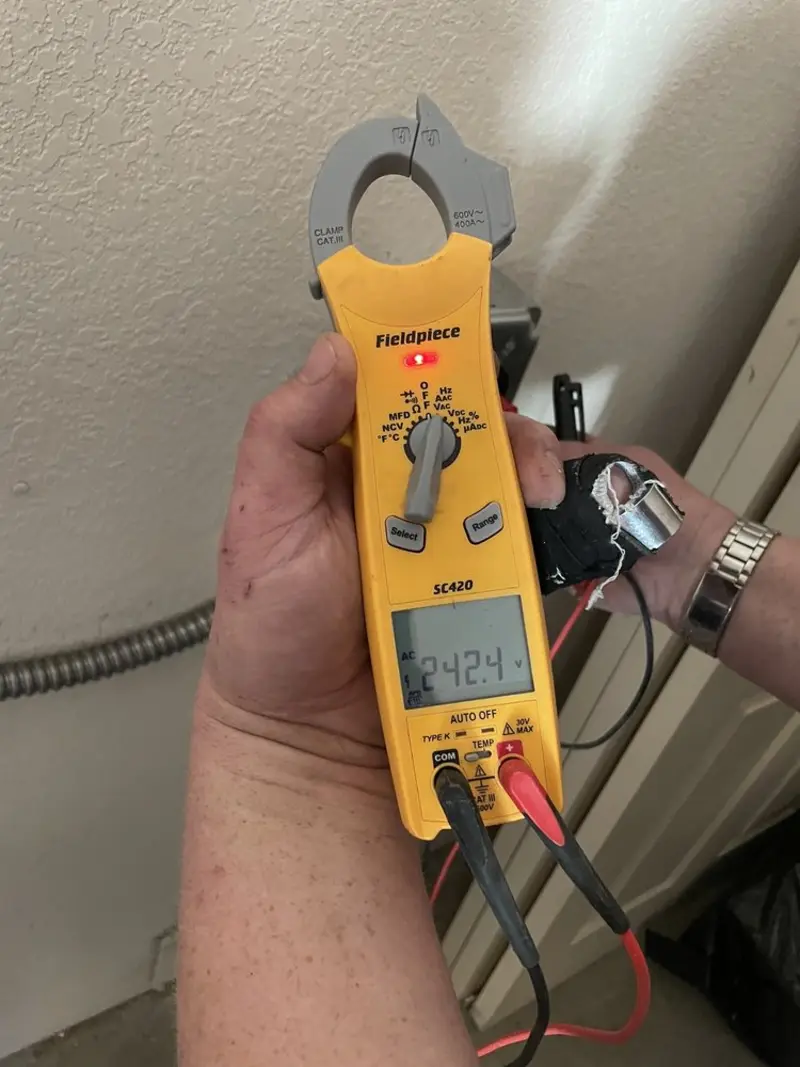 Voltage testing with clamp meter during Electrical Installation Services in Chardon
